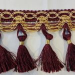 Passamaneria bordeaux e giallo oro con nappe