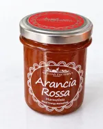 Marmellata di arancia rossa Sicilian Factory 240 g in vasetto di vetro su sfondo chiaro